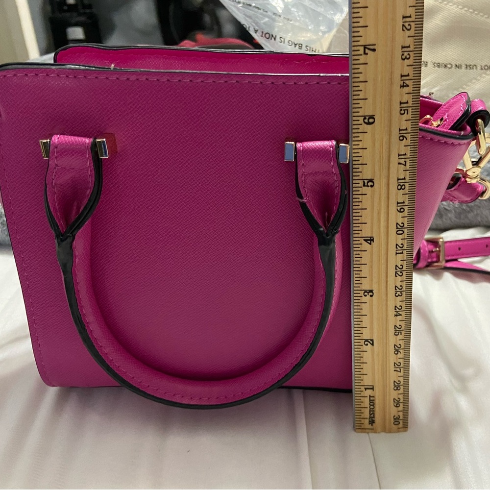 Small Caprisa pink purse. Never used. Added ruler to show size.